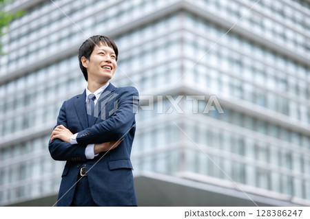 Businessman with arms folded Businessman with arms folded 128386247