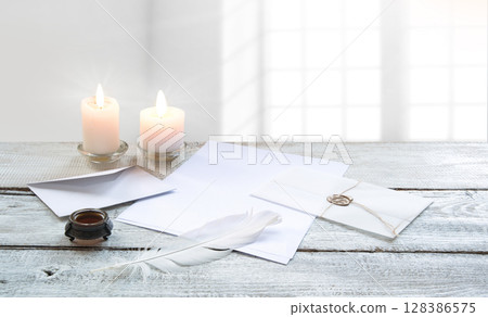 Envelope and paper with pen on the table Envelope and paper with pen on the table 128386575