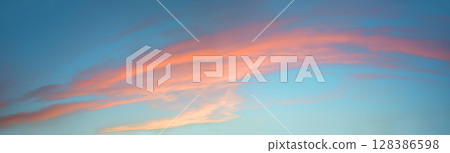 Bright clouds in the evening sky 128386598