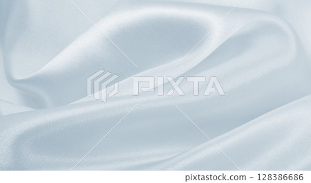 Smooth elegant grey silk or satin luxury cloth as wedding background. Luxurious background design 128386686