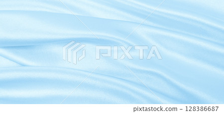 Smooth elegant blue silk or satin luxury cloth texture as abstract background. Luxurious background design Smooth elegant blue silk or satin luxury cloth texture as abstract background. Luxurious background design 128386687