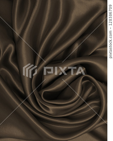 Smooth elegant brown silk or satin luxury cloth texture as abstract background. Luxurious background design wallpaper. In Sepia toned. Retro style 128386709