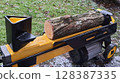 Log Splitter Machine Preparing to Split Firewood Outdoors 128387335