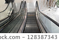 Empty escalators going up and down in a modern shopping mall 128387343