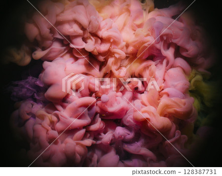 Color blend. Paint splash. Defocused yellow purple pink glitter swirling liquid spreading on abstract art dark black round creative background. 128387731