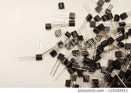 A scattering of plastic transistors. A bipolar transistor for electronics. 128388451