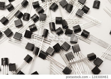 A scattering of plastic transistors. A bipolar transistor for electronics. 128388461