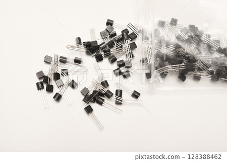 A scattering of plastic transistors. A bipolar transistor for electronics. 128388462