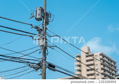 Blue sky, utility poles and pole fittings Blue sky, utility poles and pole fittings 128388904