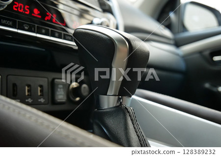 Transmission Shifter With Aluminum Elements In Leather Car Interior Closeup Stock Photo Transmission Shifter With Aluminum Elements In Leather Car Interior Closeup Stock Photo 128389232