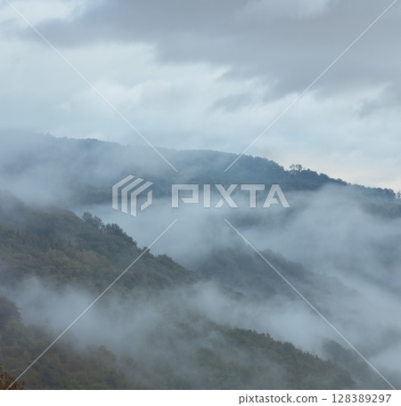 Evening mist in mountain. 128389297