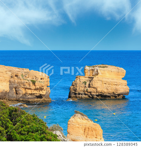 Limestone cliff near shore (Algarve, Portugal). 128389345