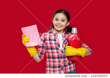 happy girl with softener detergent in studio. girl with softener detergent on background 128390854