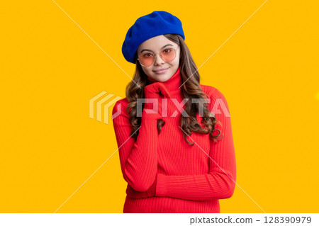 Girl in autumn jumper isolated on yellow. Teen girl wear sunglasses. Autumn fashion girl. Trendy and stylish teenager girl smiling. Fall style for teen. Trendy portrait of fall style. Parisian chic 128390979