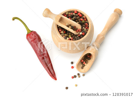 Mix of different types of pepper in wooden bowl isolated on white background. 128391017