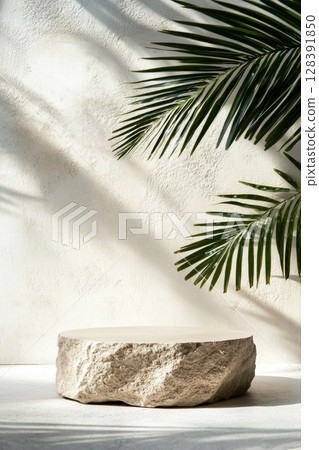 Natural Stone Table Framed by Palm Leaves Creating a Calming Atmosphere in a Serene Setting. 128391850