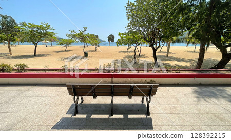 Outdoor beach, sands, trees, water, garden wooden bench in Hong Kong Repulse Bay 128392215