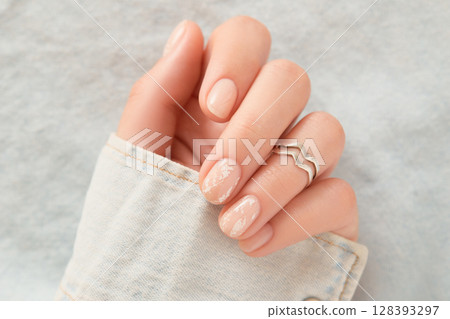 Beautiful womans hands with nude nail design. Manicure, pedicure beauty salon concept Beautiful womans hands with nude nail design. Manicure, pedicure beauty salon concept 128393297
