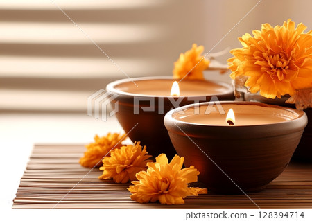 Cozy arrangement of handcrafted clay diyas oil lamps surrounded by vibrant marigold flowers creating a warm inviting and serene atmosphere for a festive occasion Cozy arrangement of handcrafted clay diyas oil lamps surrounded by vibrant marigold flowers creating a warm inviting and serene atmosphere for a festive occasion 128394714