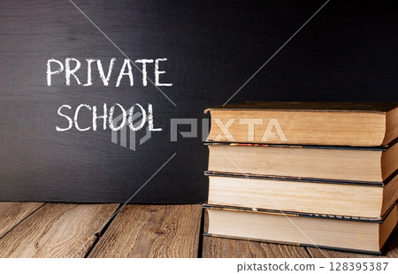 Private school is written on a chalkboard 128395387