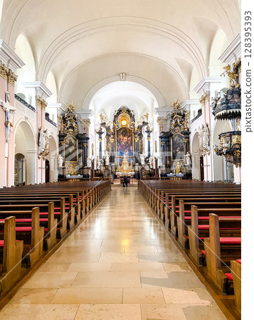 The church is very large and has many pews 128395393