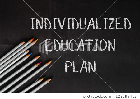 A chalkboard with a pencils 128395412