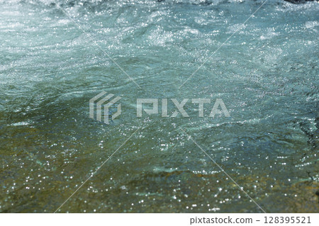 An image of a crystal clear stream bathed in the rays of summer light (Kumamoto Prefecture, Kuma District) An image of a crystal clear stream bathed in the rays of summer light (Kumamoto Prefecture, Kuma District) 128395521