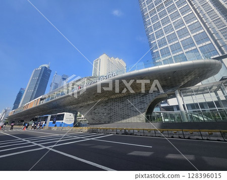 Modern Elevated Train Station in Jakarta with Skyscrapers Modern Elevated Train Station in Jakarta with Skyscrapers 128396015