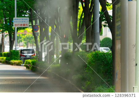 Mist shower at the bus stop 128396371