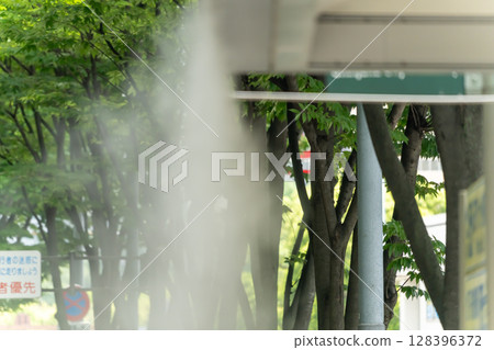Mist shower at the bus stop 128396372