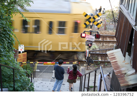 Couple waiting for a railroad crossing Couple waiting for a railroad crossing 128396752