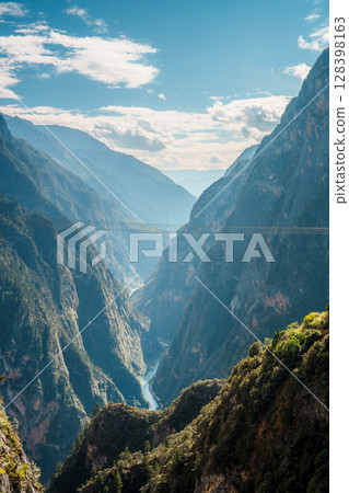 Deep river canyon cutting through Balagezong mountains in Shangri-la, China Deep river canyon cutting through Balagezong mountains in Shangri-la, China 128398163
