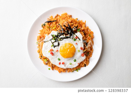 Korean kimchi fried rice with fried egg, pork, sesame seed, chili, spring onion and seaweed 128398337