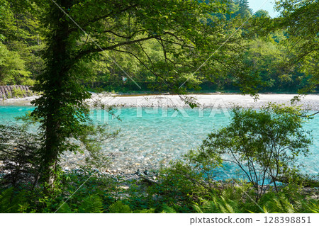 Nagano Kamikochi Beautiful emerald green clear stream 128398851