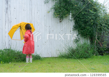 Girls playing in the rain Girls playing in the rain 128399585