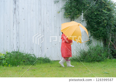 Girls playing in the rain Girls playing in the rain 128399587
