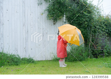 Girls playing in the rain Girls playing in the rain 128399588