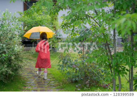 Girls playing in the rain Girls playing in the rain 128399589