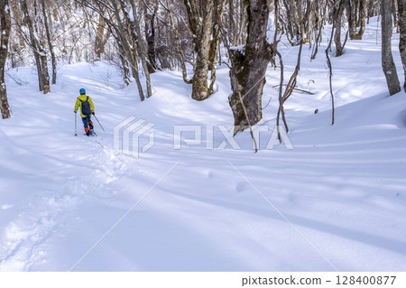 Image of enjoying fresh snow in the forest on snowshoes Oyamakiyazawa mountain stream 128400877