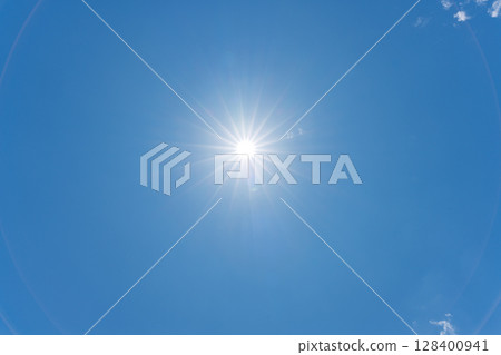 The sun shining in the blue sky. Copy space available. (Photographing the sky from Aso, a natural landscape) 128400941