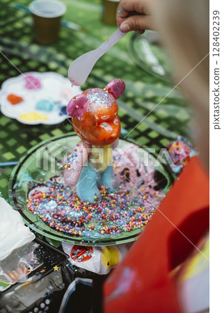 Creative Art Activity with Painted Bear Figurine 128402239