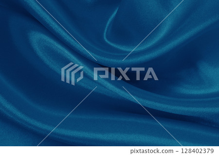 Dark blue fabric cloth texture for background and design art work, beautiful crumpled pattern of silk or linen. 128402379
