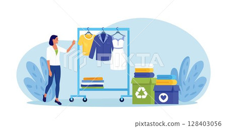 Cloth recycling. Woman packing box with clothes at wardrobe for donation. Recycle and sustainable fashion. Eco-friendly production fabric. People donate dress for benefaction. Charity, social care 128403056