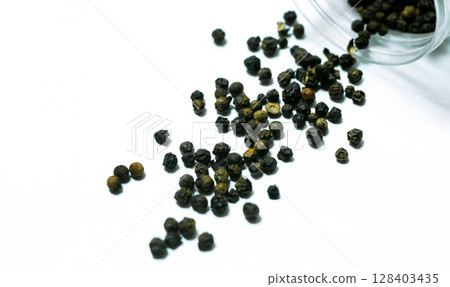 Black pepper isolated on a white background Black pepper isolated on a white background 128403435