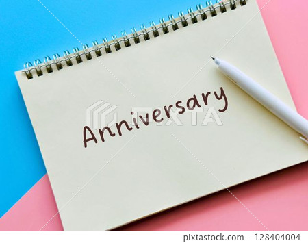 A notebook with the word "anniversary" written on it A notebook with the word "anniversary" written on it 128404004