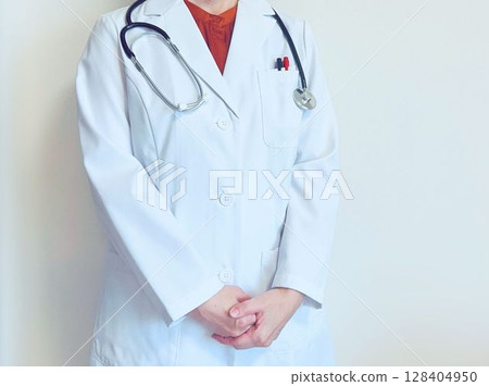 Female doctor standing Female doctor standing 128404950