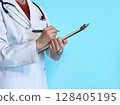 Female doctor conducting a hearing (light blue background) 128405195