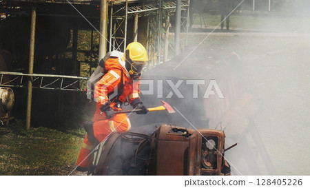 Firefighter fighting smoke flame use fire hose chemical water foam spray engine. Firefighter Rescue training in fire fighting extinguisher. Fireman wear hard hat safety suit uniform for protection 128405226