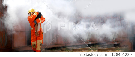 Firefighter Rescue training in fire fighting extinguisher. Firefighter fighting with flame using fire hose chemical water foam spray engine. Fireman wear hard hat, safety suit uniform for protection 128405229