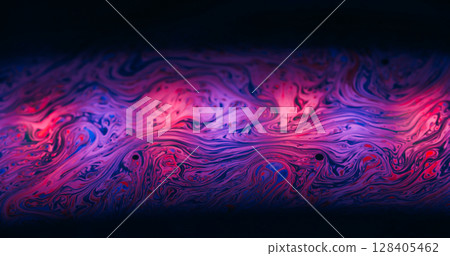 Fabulous paint flow. Gasoline texture. Pink purple color ink soap stream art light reflection. Dye mix defocused abstract black background. 128405462